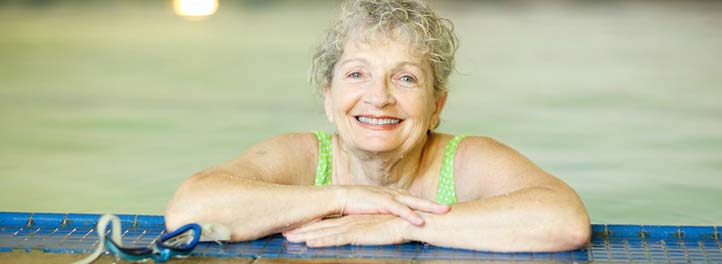 An elderly woman in a swimming pool