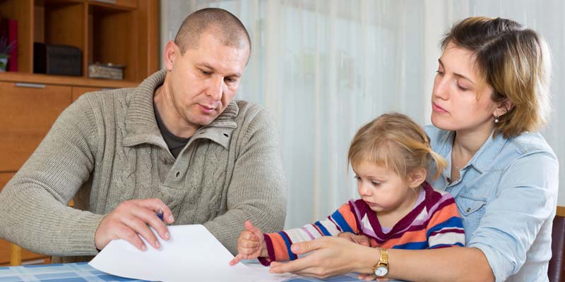 A family reviewing paperwork
